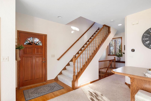 entryway with recessed lighting, baseboards, and wood finished floors