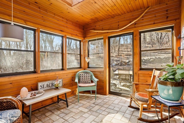 sunroom / solarium with lofted ceiling and wooden ceiling