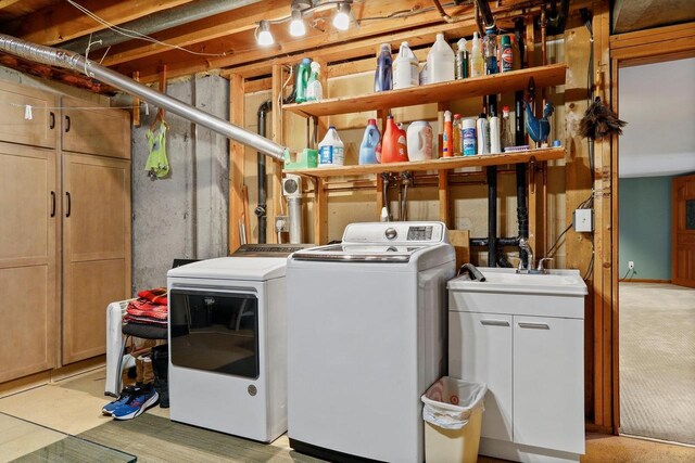 laundry area with washer and dryer and cabinet space