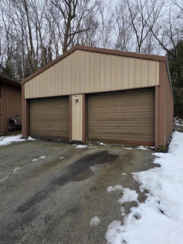 view of snow covered garage