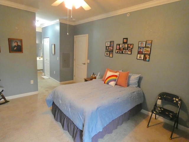 bedroom featuring ensuite bathroom, light carpet, baseboards, attic access, and crown molding