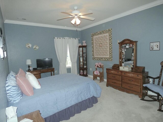 bedroom with ceiling fan, carpet floors, ornamental molding, and baseboards