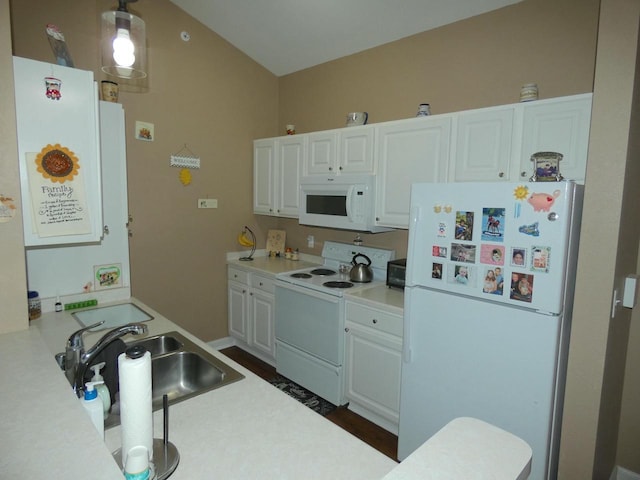 kitchen featuring light countertops, white appliances, a sink, and white cabinets