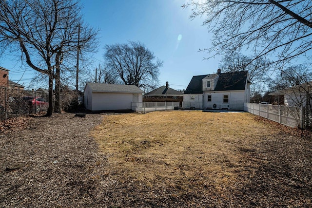 view of yard with a fenced backyard, an outdoor structure, and a storage shed