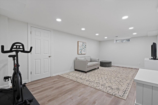 exercise area with recessed lighting, baseboards, and wood finished floors