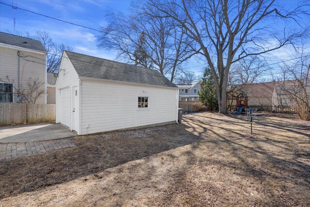 detached garage with fence