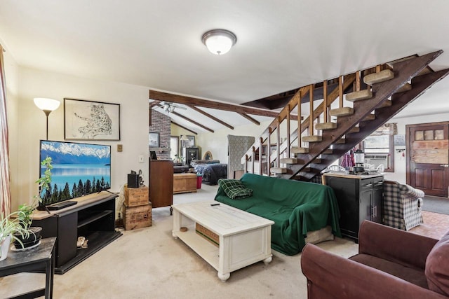 living room featuring vaulted ceiling with beams, stairway, and carpet flooring