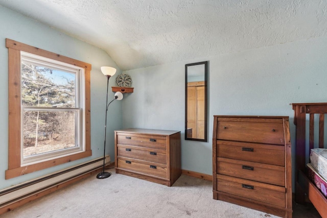 bedroom featuring baseboard heating, carpet flooring, vaulted ceiling, a textured ceiling, and baseboards