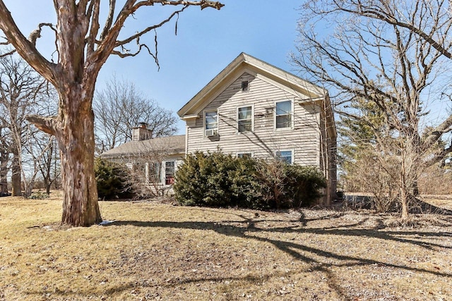 view of side of property with a chimney