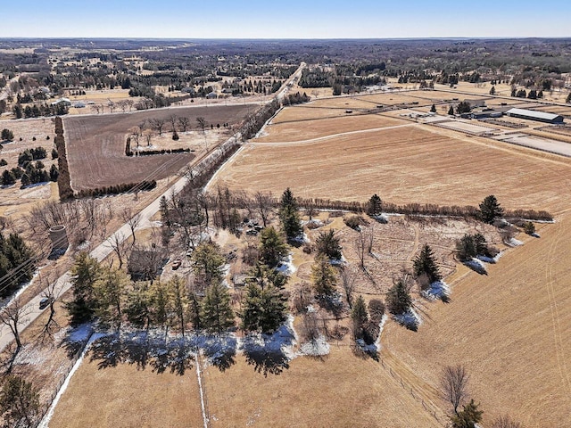 birds eye view of property with a rural view