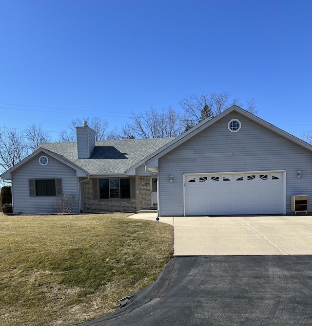 ranch-style home with roof with shingles, concrete driveway, a front yard, brick siding, and a chimney