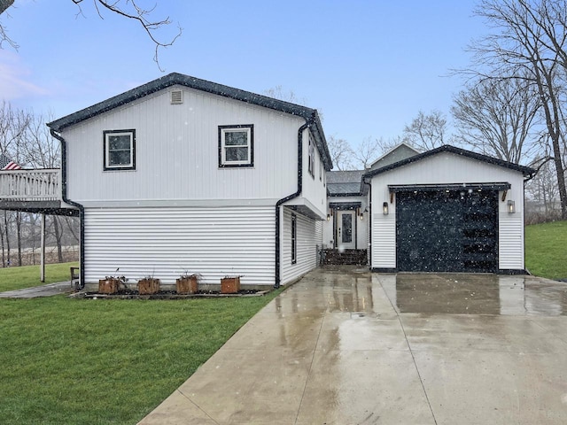 view of front of house with driveway, a garage, and a front lawn