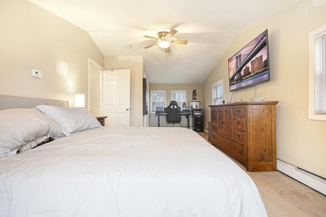 bedroom featuring a baseboard heating unit, vaulted ceiling, carpet flooring, and a ceiling fan