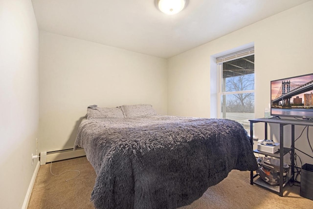 carpeted bedroom featuring baseboards and baseboard heating