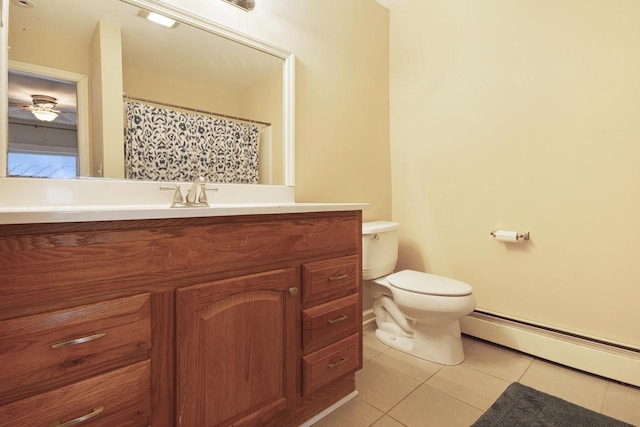 full bath with a baseboard radiator, toilet, ceiling fan, vanity, and tile patterned flooring