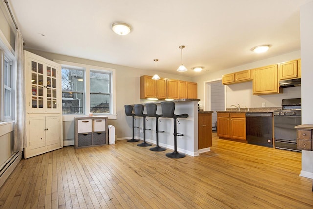 kitchen with a baseboard heating unit, a peninsula, dishwasher, light wood finished floors, and range with gas cooktop