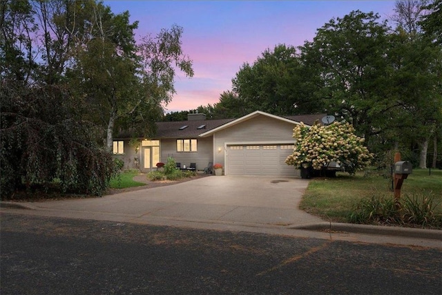 105 W Tower St, Roberts, WI 54023 - ranch-style home with a garage, driveway, and a chimney