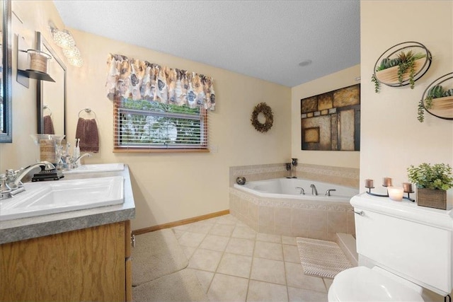 full bath with a textured ceiling, toilet, a sink, a bath, and tile patterned floors