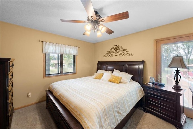 bedroom with carpet floors, ceiling fan, and baseboards