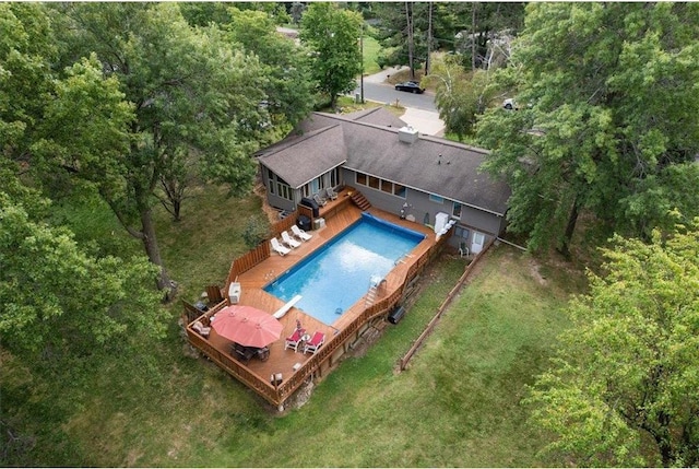 pool featuring a lawn and a deck