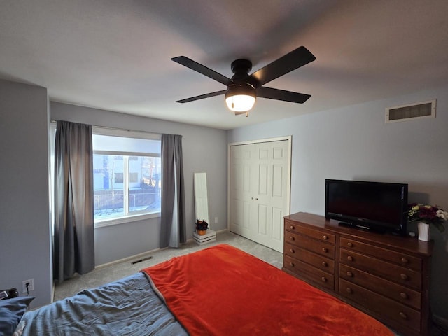 bedroom with carpet, visible vents, ceiling fan, and baseboards