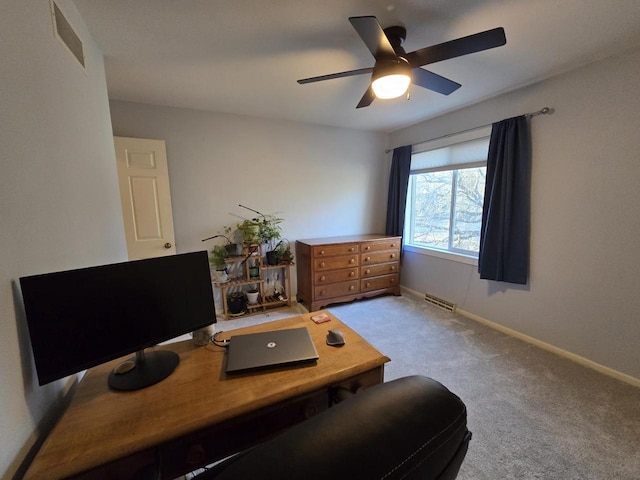 office with carpet, visible vents, ceiling fan, and baseboards