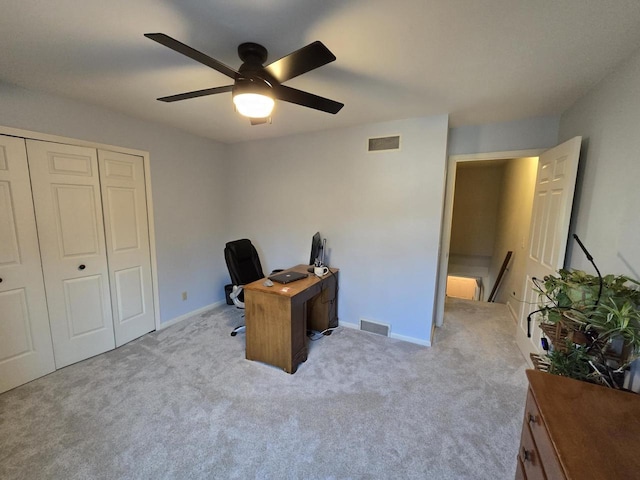 carpeted home office with visible vents and baseboards