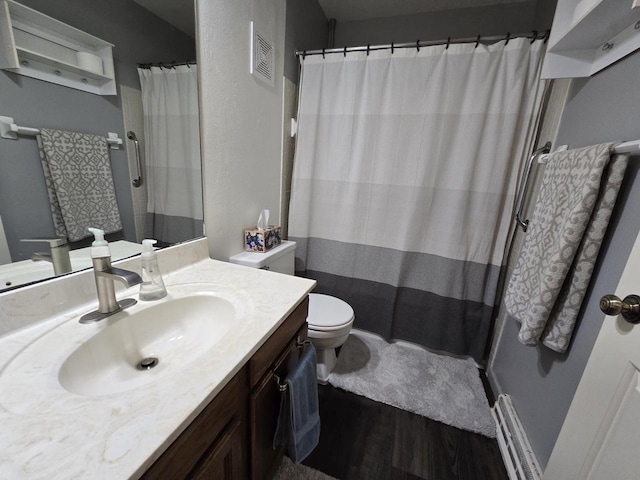 full bath featuring visible vents, toilet, vanity, wood finished floors, and a shower with curtain