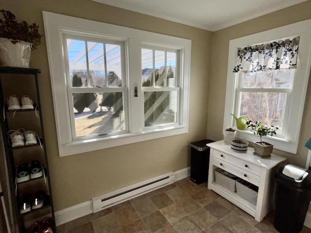 interior space with crown molding, baseboard heating, and baseboards