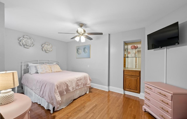 bedroom featuring light wood-type flooring, ceiling fan, and baseboards