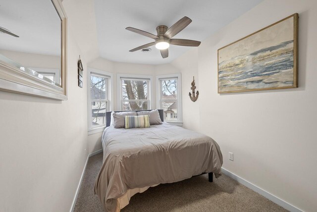 bedroom with carpet, a ceiling fan, and baseboards