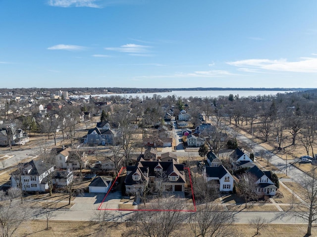 bird's eye view with a residential view and a water view