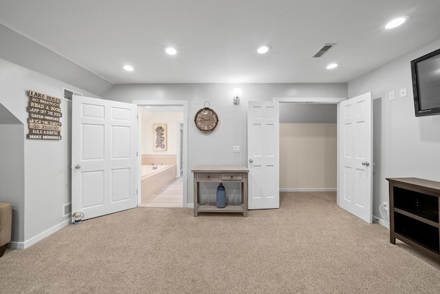 interior space with baseboards, visible vents, carpet flooring, and recessed lighting