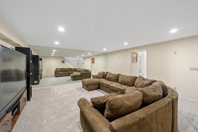 living room with recessed lighting, light carpet, and stairway