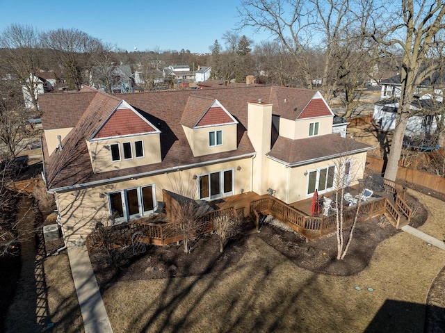 exterior space featuring fence and stucco siding