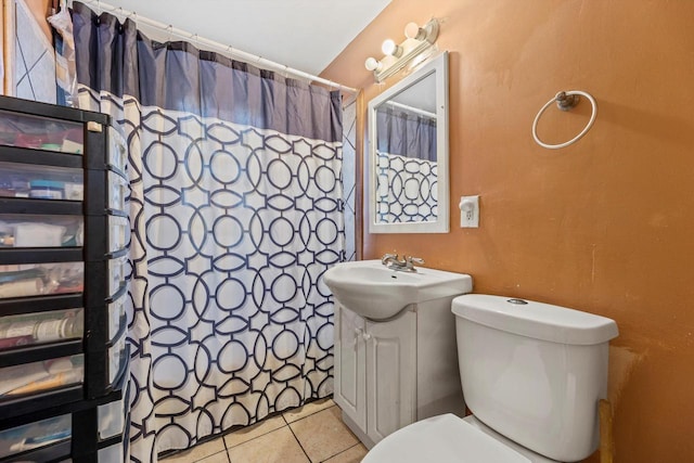 bathroom featuring vanity, curtained shower, tile patterned flooring, and toilet