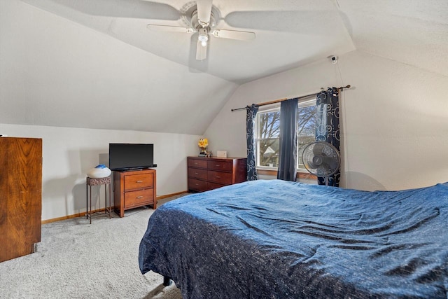 bedroom featuring vaulted ceiling, carpet flooring, and baseboards