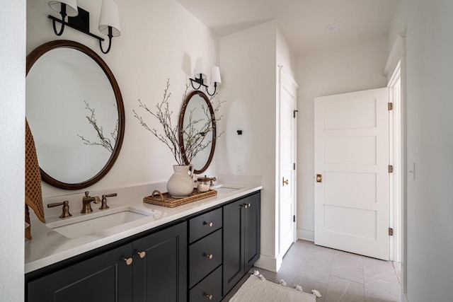 full bathroom featuring double vanity and a sink