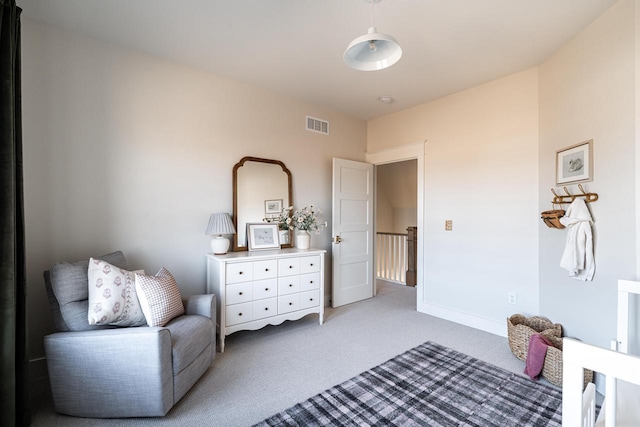 bedroom featuring visible vents, light colored carpet, and baseboards