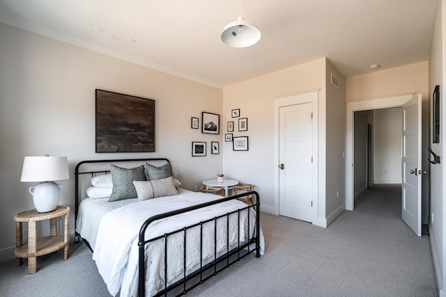 bedroom with visible vents, baseboards, and light colored carpet