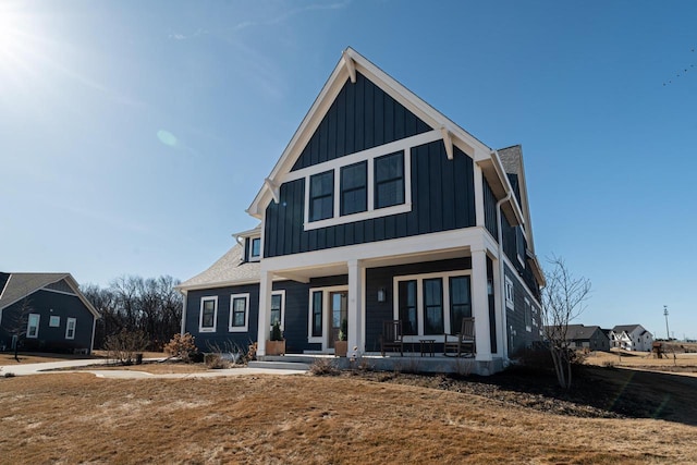 view of front of home featuring covered porch and board and batten siding