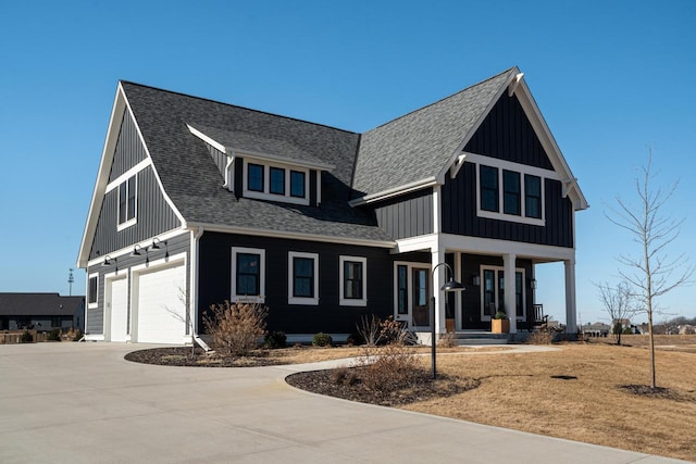 modern farmhouse featuring a garage, board and batten siding, a shingled roof, and a porch