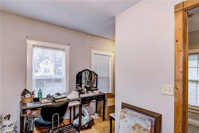 home office with wood finished floors