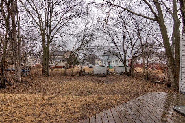 view of yard with a wooden deck