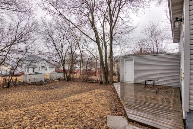 view of yard featuring an outbuilding and a deck