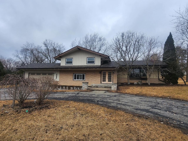 view of front of home featuring a garage and french doors