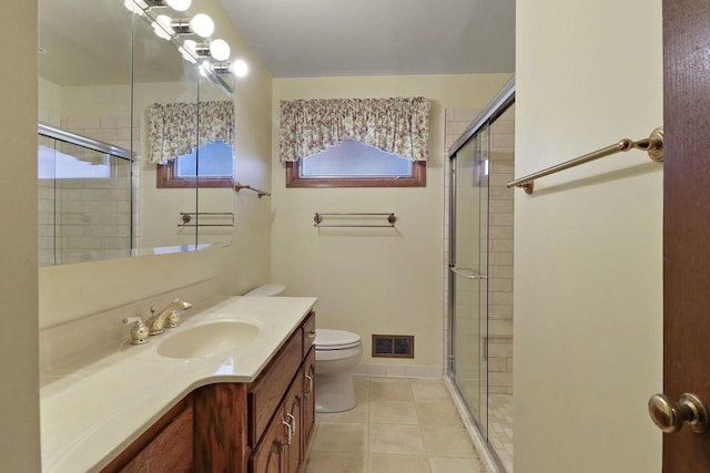 full bathroom featuring visible vents, a shower stall, toilet, and tile patterned floors