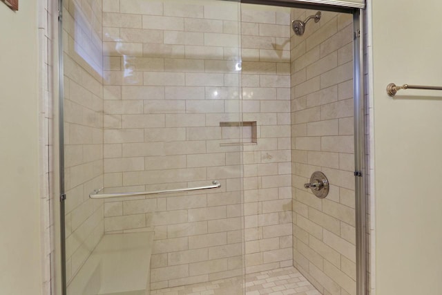 bathroom featuring a shower stall