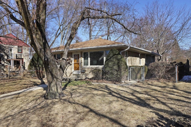 view of front of house with a gate and fence