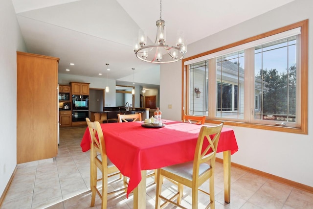 dining space with light tile patterned floors, baseboards, recessed lighting, vaulted ceiling, and a chandelier